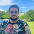 Photo de Anas, étudiant en BTS Services Informatique aux Organisations à AFTEC, il porte des lunettes, a les cheveux bruns et une barbe brune, il porte également un t-shirt coloré